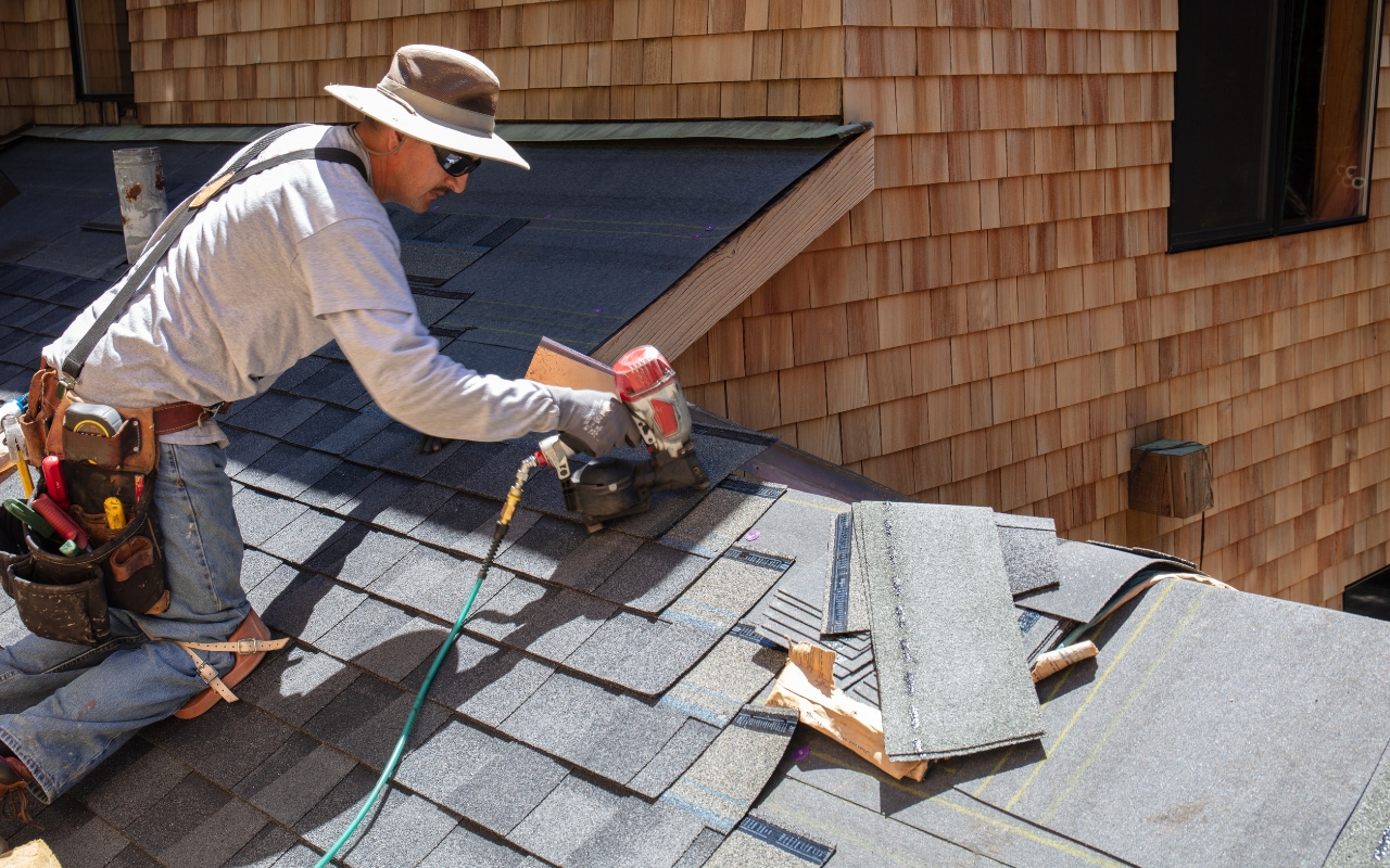 Homeowner performing DIY roof maintenance tasks