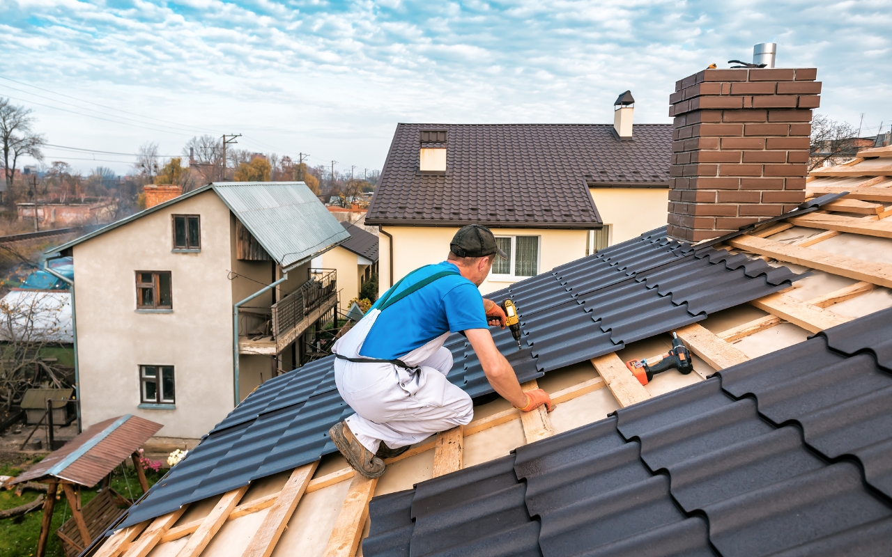 Professional roofer repairing roof to extend its lifespan