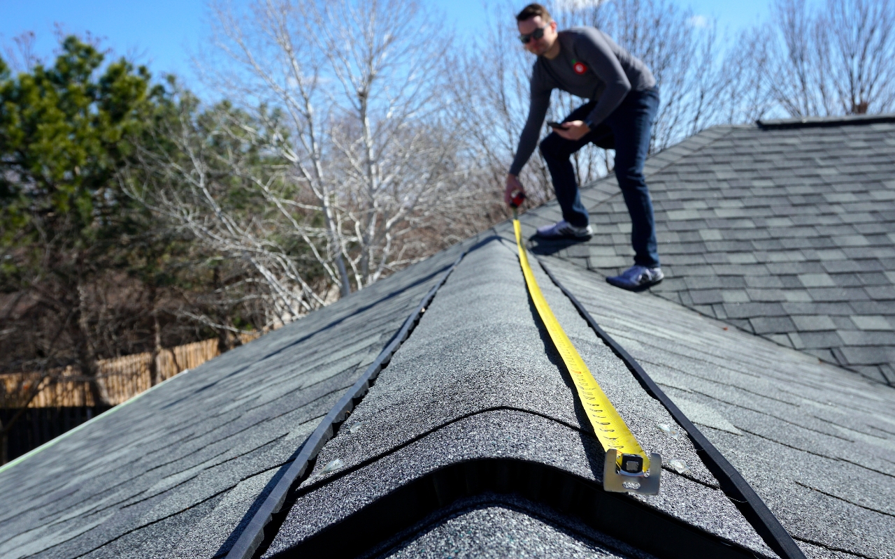 Expert conducting a roof inspection to identify issues